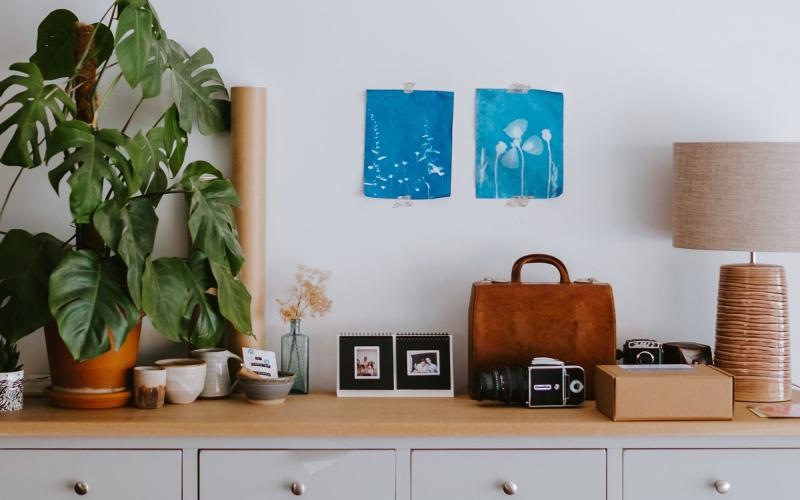 large dresser with a variety of decor on it